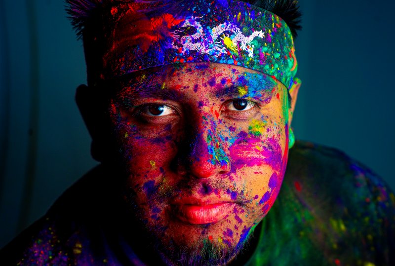 Creative portrait — neon color powder face